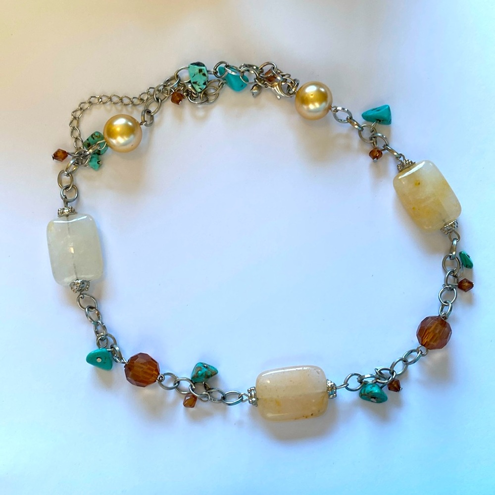 Silver chain necklace with pearls, stones, and turquoise.